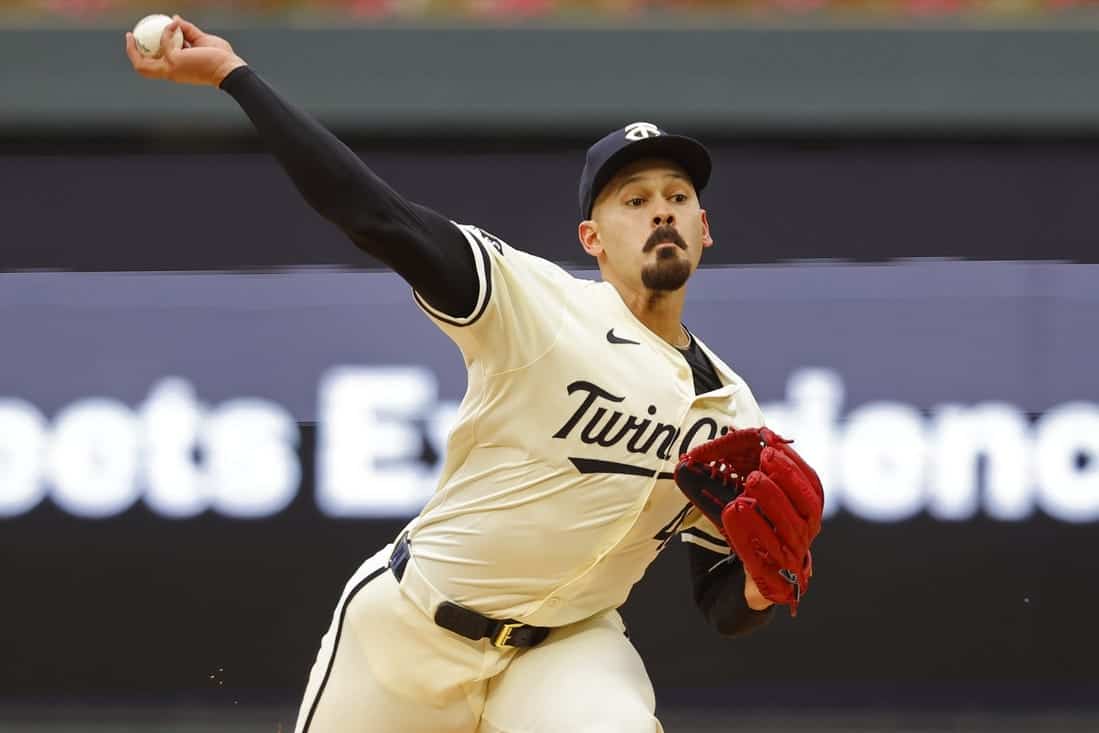 Twins pitching a ball