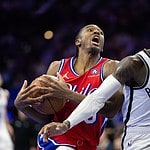 76ers player going for a layup