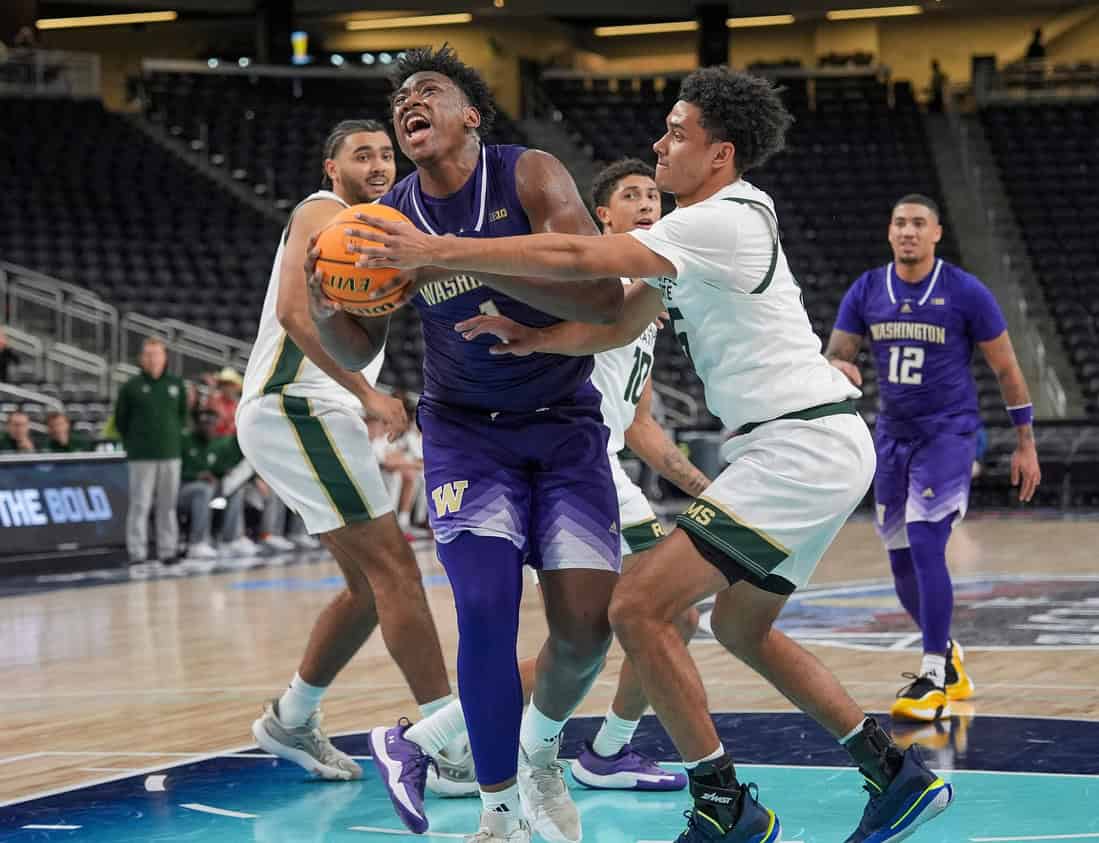 Huskies Player Atacking the rim