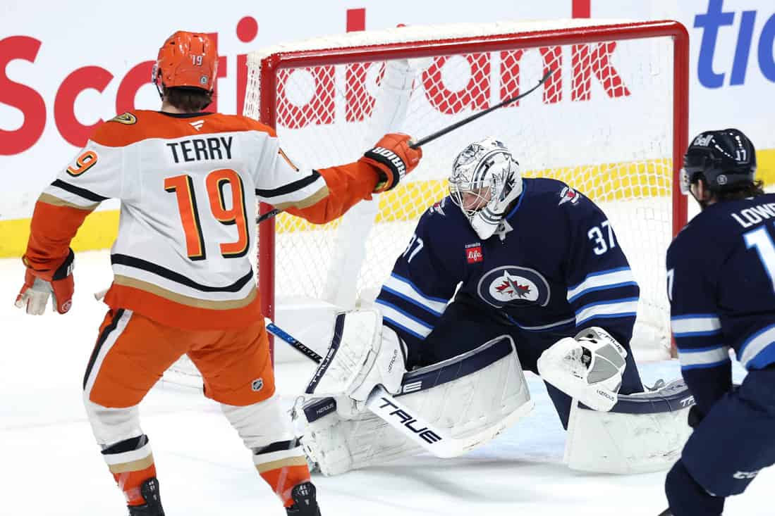 Ducks player shooting the puck